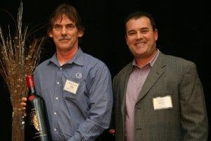 John Cunningham accepts WINnovation Award from George Christie.