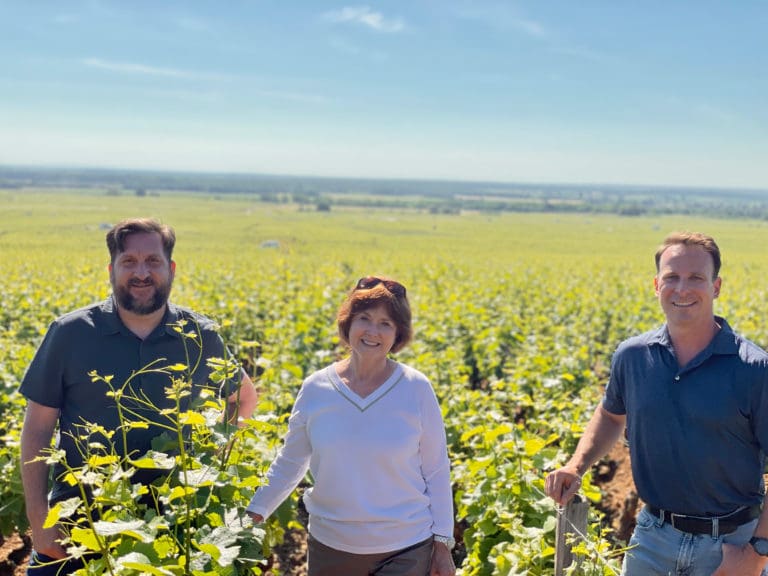 VP of Winemaking & Viticulture Michael Fay, Owner_Founder Grace Evenstad, CEO_President Ryan Harris in Clos de Vougeot vineyard