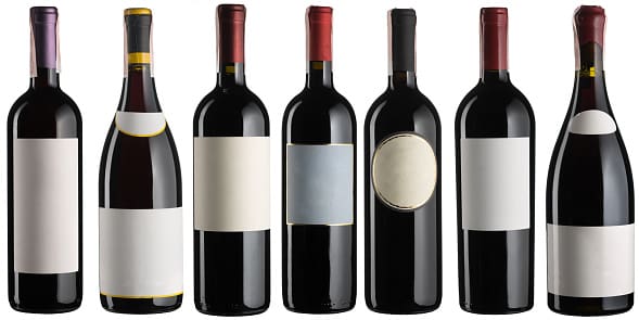 Set of multiple red wine bottles isolated on white