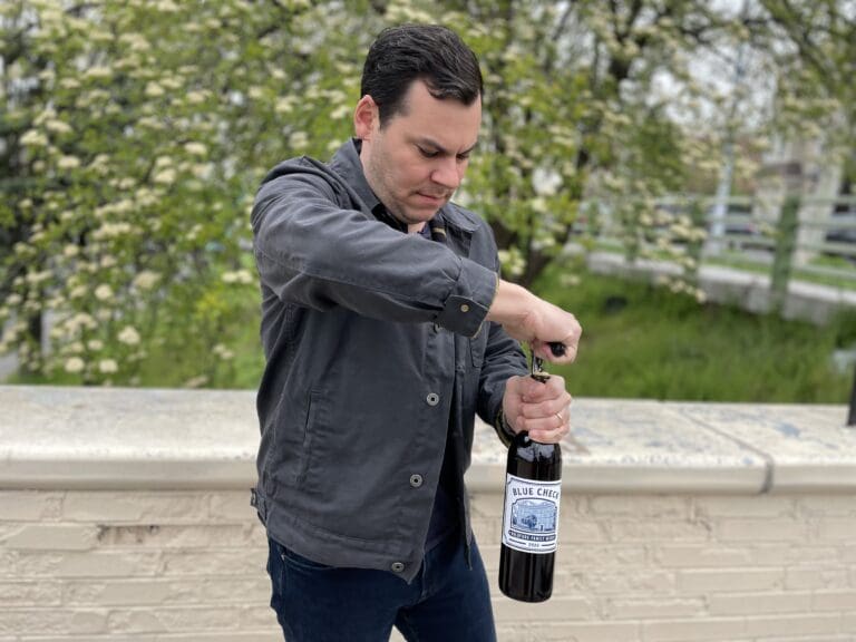 Aaron Goldfarb opening his wine near his Brooklyn estate_Photo courtesy of Goldfarb Family Wines