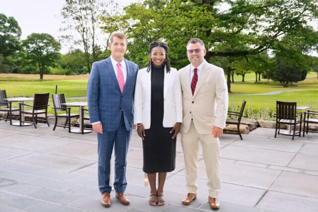 Posing during the June 13 open house at the Crossvines are, from left, CEO Keith Miller, Washington D.C. News4 Today co-anchor Jummy Olabanji, and Marc Weller of Weller Development Company. [Credit: The Crossvines]