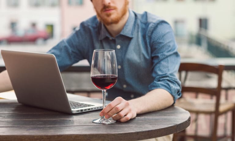 Young,Hipster,Man,Sitting,At,Outdoor,Bar,Table,With,His