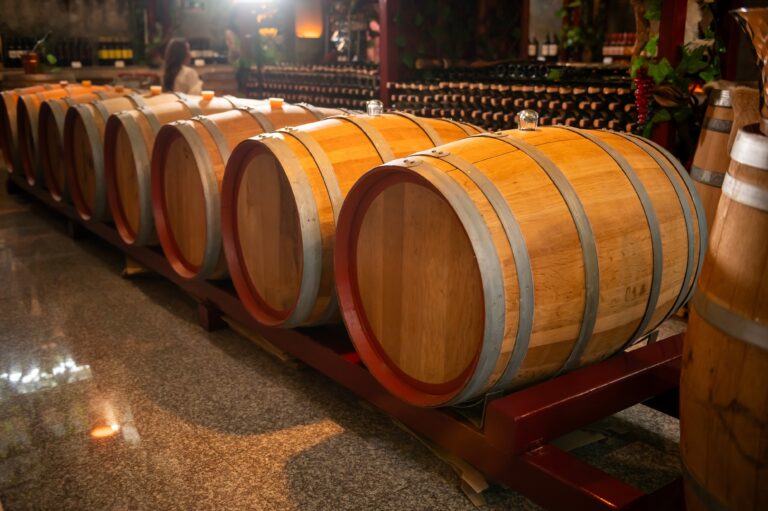 Old,Wooden,Wine,Barrels,Stacked,In,A,Cellar,In,Order